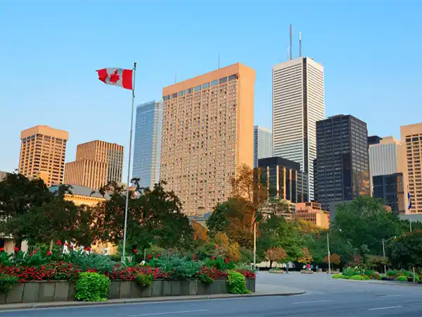 Port Moody urban community with Canadian flag and high-rise buildings
